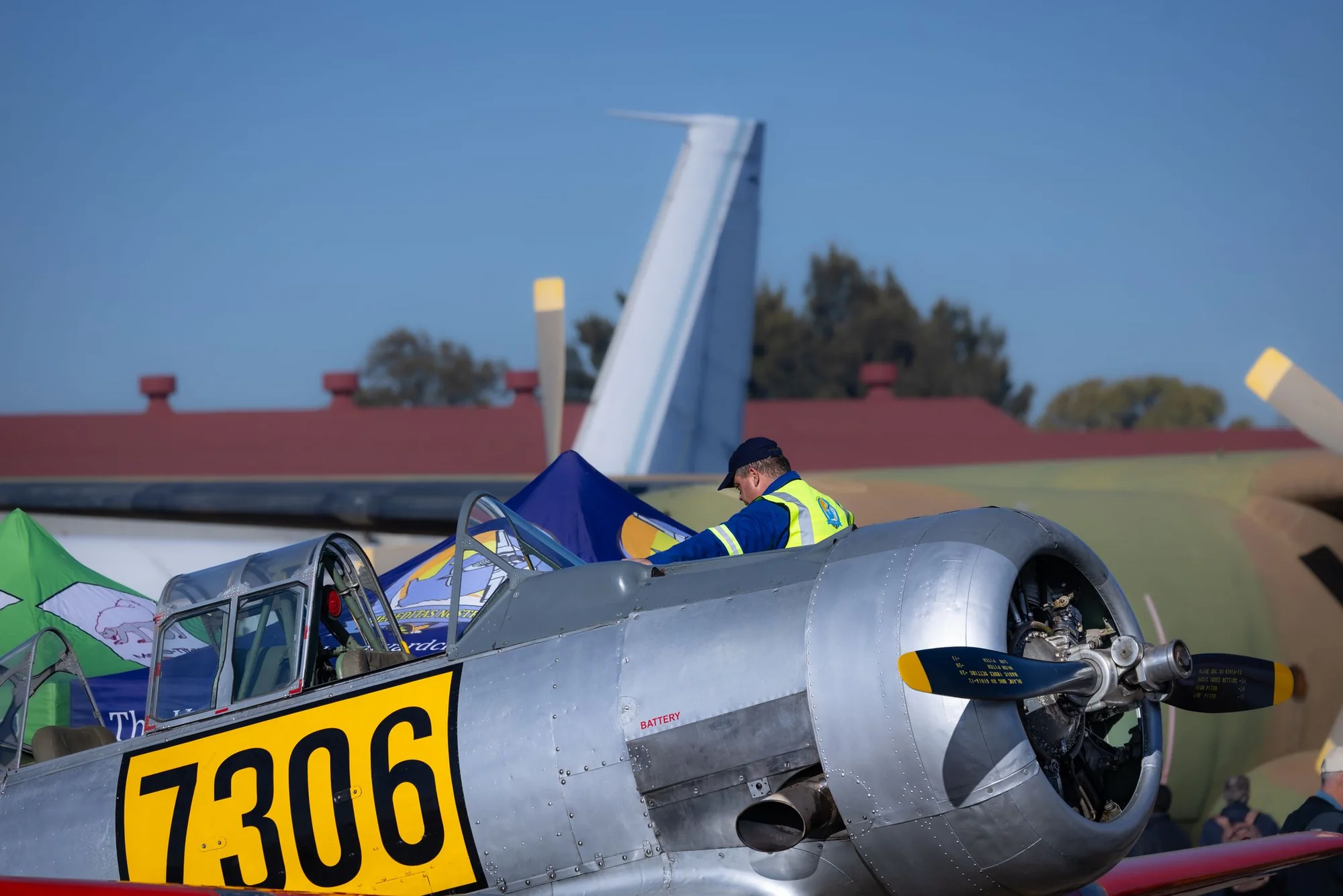 A mechanic working on a vintage aircraft